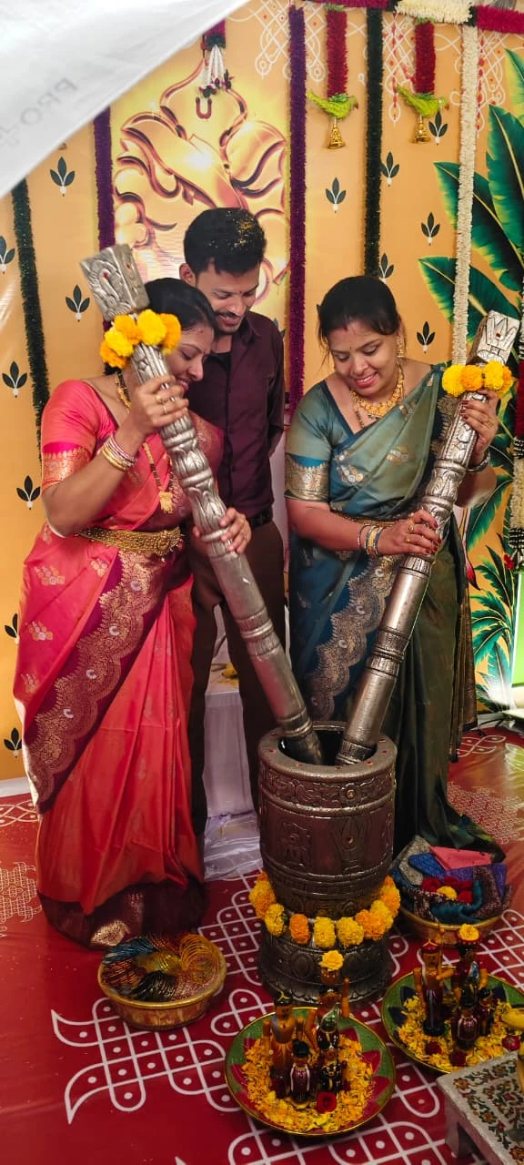Traditional Telugu ceremony with the couple and ceremonial pestles